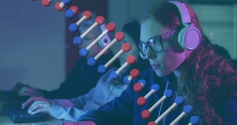 Researcher Analyzing Monitor with 3D DNA Visualization