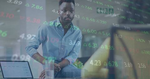 Businessman Collaborating in Modern Office with Stock Display