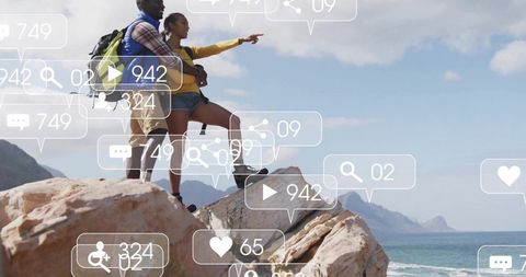 Couple Exploring Rocky Mound Overlooking Sea with Social Media Overlay