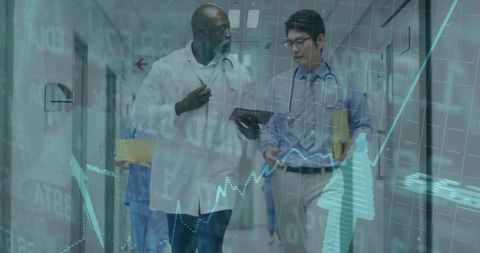 Doctors Analyzing Data with Digital Medical Charts