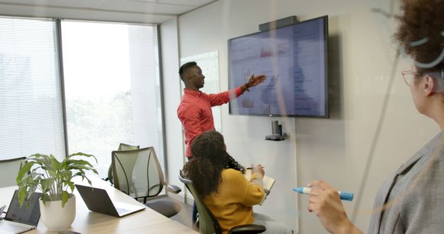 Team Collaborating in Meeting Room with Visual Presentation - Download Free Stock Images Pikwizard.com