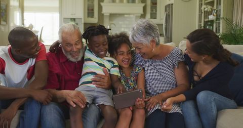 Happy Multigenerational Family Enjoying Time on Couch