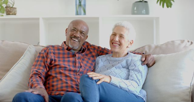 Content Senior Biracial Couple Relaxing at Home, Embracing and Talking on Comfortable Couch - Download Free Stock Images Pikwizard.com