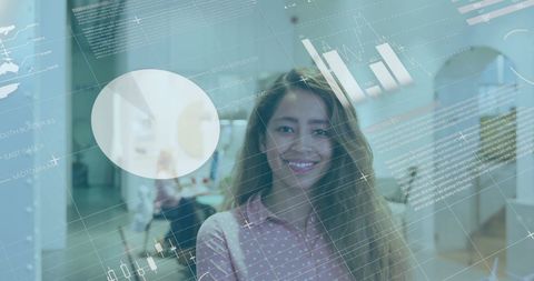 Smiling Businesswoman in Office with Digital Financial Graphs