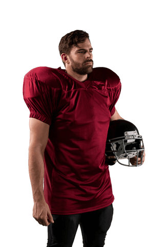 Serious football player holding helmet on transparent background