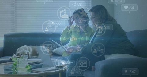 Two Women Collaborating on Laptop with Social Media Icons Overlay