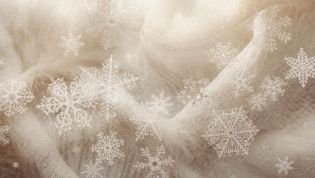 Cream knit fabric with delicate snowflake overlay and soft fuzzy texture for winter designs