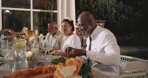 Elegant backyard wedding dinner with friends celebrating