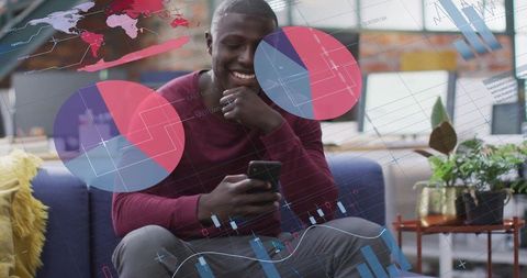 Smiling man engaging with smartphone amidst data visualizations