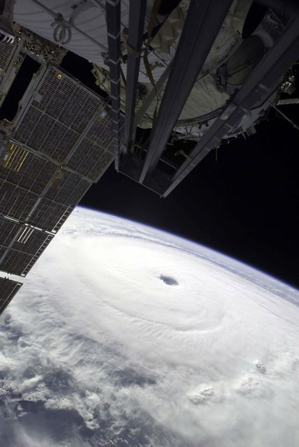 Except for a small portion of the International Space Station (ISS) in the foreground, Hurricane Ivan, one of the strongest hurricanes on record, fills this image over the northern Gulf of Mexico. As the downgraded category 4 storm approached landfall on the Alabama coast Wednesday afternoon on September 15, 2004, sustained winds in the eye of the wall were reported at about 135 mph. The hurricane was photographed by astronaut Edward M. (Mike) Fincke from aboard the ISS at an altitude of approximately 230 miles. Crew Earth Observations record Earth surface changes over time, as well as more fleeting events such as storms, floods, fires, and volcanic eruptions.