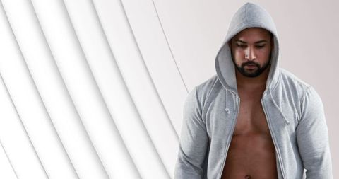Athletic Man Concentrating in Gray Hoodie Against Abstract Background - Download Free Stock Images Pikwizard.com