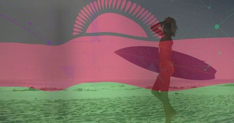 Surfer carrying board on beach at sunset silhouette