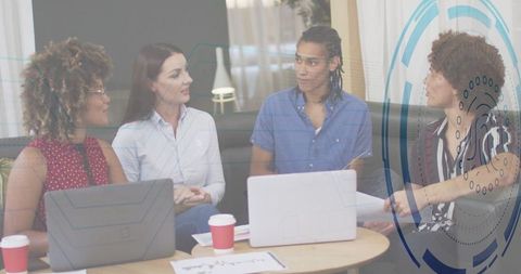 Diverse Team Collaboration in Modern Office Lounge