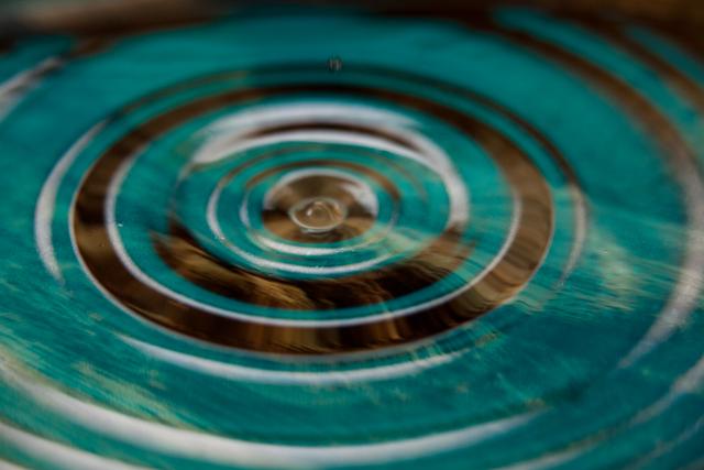 Close-Up of Ripples in Water with Turquoise and Brown Tones - Download Free Stock Photos Pikwizard.com