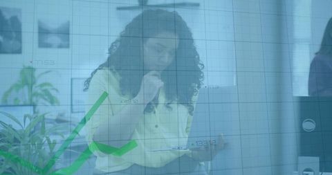 Professional woman analyzing financial growth on tablet