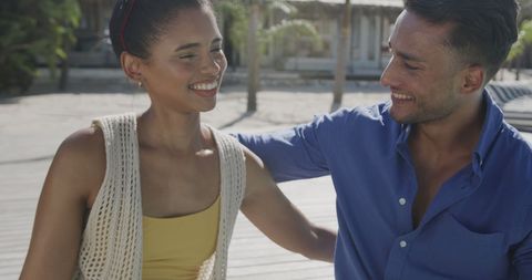 Happy Couple Relaxing at Beachside in Summer Sun