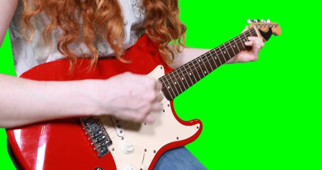 Person playing electric guitar designed for video projects, music promotions, and educational tutorials. Image perfect for adding custom backgrounds, music websites, and advertisements.