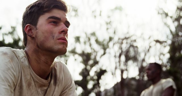 Exhausted Young Man with Dirty Face After Physical Activity in Outdoors Setting - Download Free Stock Images Pikwizard.com