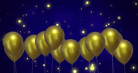 Gold Balloons with Glowing Lights Against Blue Background Celebrating - Download Free Stock Images Pikwizard.com