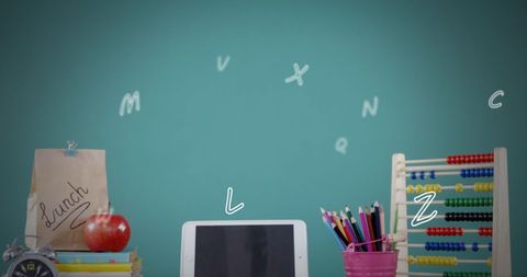 Colorful School Supplies and Falling Letters with Tablet