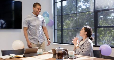 Office celebration multiracial colleagues enjoy workplace party