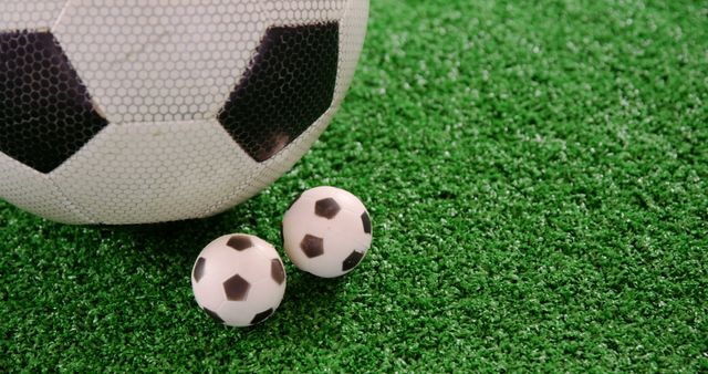 Large and Small Soccer Balls on Artificial Grass - Download Free Stock Images Pikwizard.com