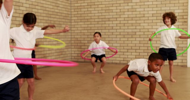 Group of Children Playing with Hula Hoops Indoors - Download Free Stock Images Pikwizard.com