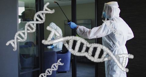 Disinfecting technician wearing ppe spraying lobby glass with dna helix overlay, reflective