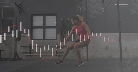 Active woman stretching in gym with fitness chart overlay