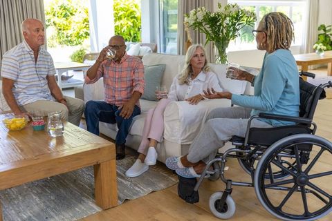 Senior Friends Enjoying Leisure Time in Cozy Living Room
