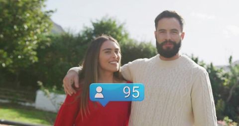 Happy Couple Embracing Outdoors with Social Media Notification