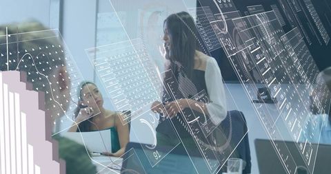 Female Executive Presenting Interactive Digital Analytics to Team in Futuristic Sunlit Boardroom