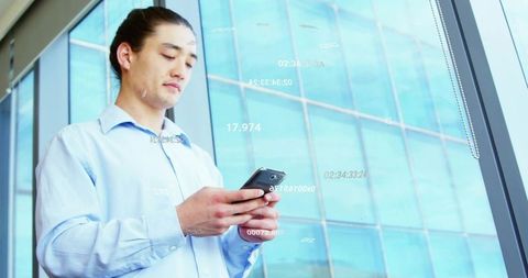 Businessman checking smartphone with digital hud overlay by glass office facade urban corporate