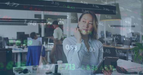 Businesswoman Analyzing Stock Data in Modern Office