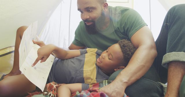 Father and Son Bonding in Cozy Tent Setting - Download Free Stock Images Pikwizard.com