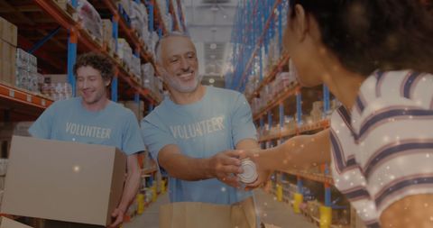 Teamwork at Warehouse: Volunteers Distributing Goods - Download Free Stock Images Pikwizard.com