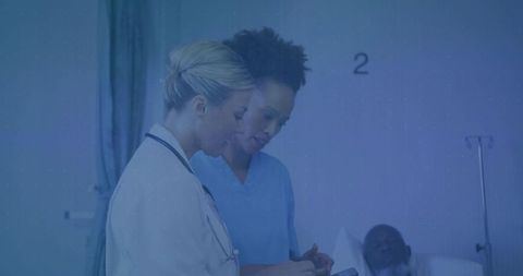 Medical Professionals Collaborating in Hospital Room with Patient