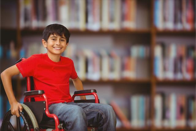 Happy boy in wheelchair against blurred background - Download Free Stock Photos Pikwizard.com