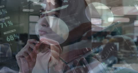 Thoughtful Professional Analyzing Data with Futuristic Display