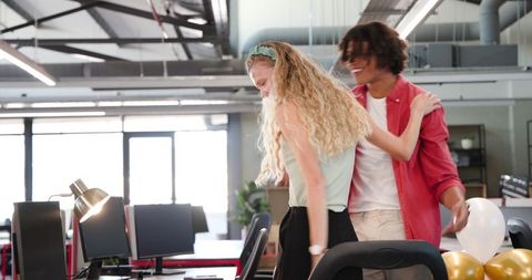 Diverse Colleagues Celebrating with Balloons in Modern Office