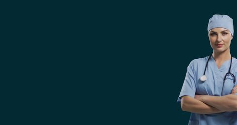 Confident female doctor in blue scrubs with stethoscope