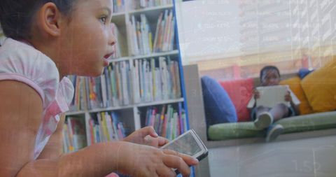 Children using digital devices in modern learning environment