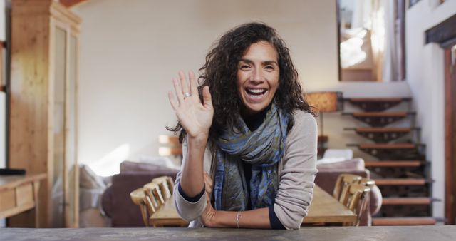 Cheerful Woman Waving Hand in Cozy Rustic Living Room - Download Free Stock Images Pikwizard.com