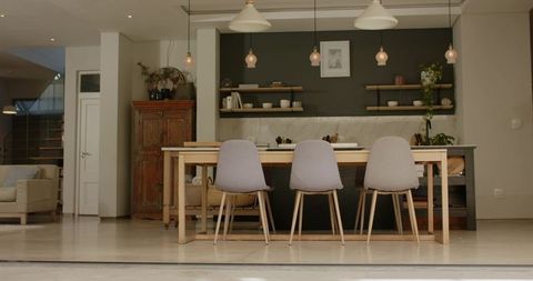 Modern minimalist kitchen interior with contemporary dining set