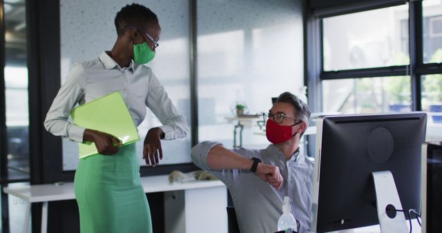 Colleagues Wearing Masks Greeting Each Other with Elbow Bump in Modern Office - Download Free Stock Images Pikwizard.com