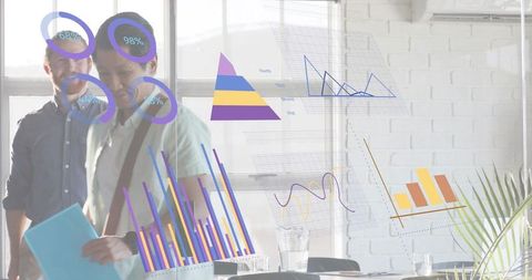 Team collaborating behind glass wall displaying transparent data dashboards and analytics