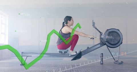 Caucasian woman exercising with data graph overlay at gym