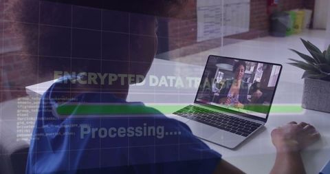 Healthcare Professional Using Laptop with Encrypted Data Overlay
