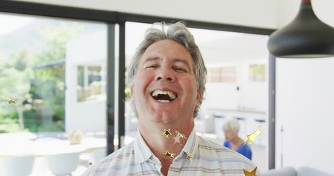 Cheerful Man in Modern Home with Sliding Glass Doors