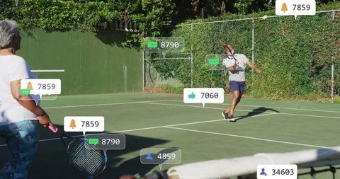 Active seniors playing tennis with digital engagement icons
